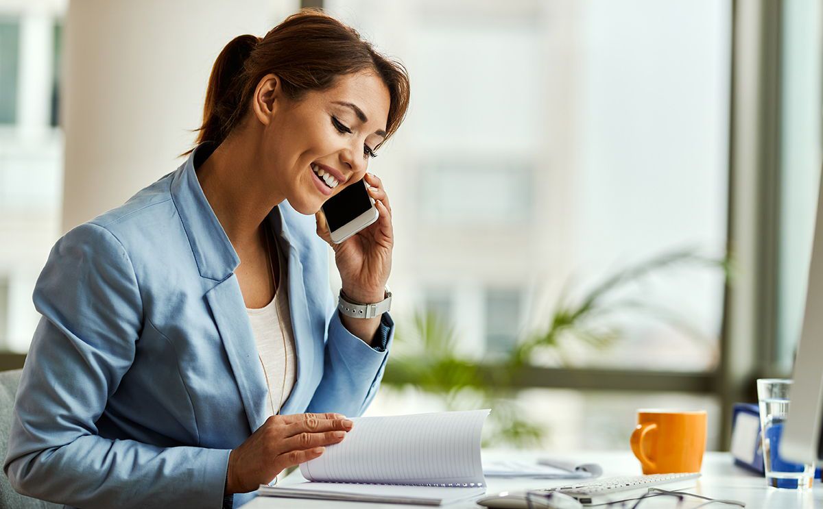 Smiling businesswoman making phone call