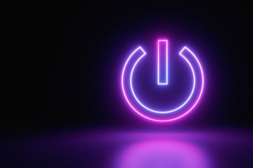 Illuminated neon power button representing KPMG Ignition