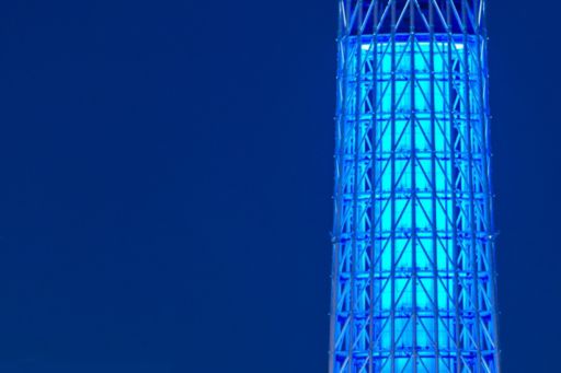 illuminated high tower against blue background