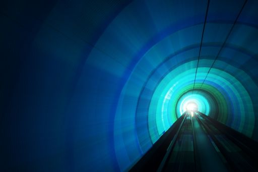 Illuminated train tunnel blue green
