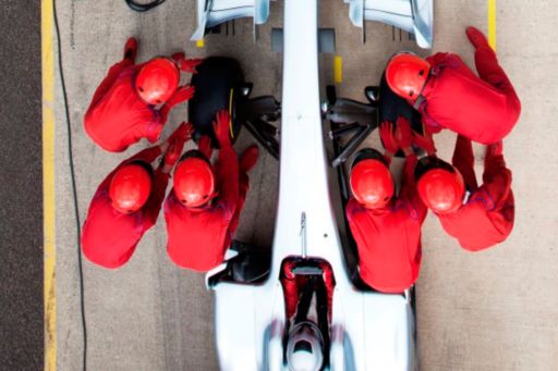pit crew working together