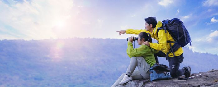 isg-lady-man-looking-binocular-provisions-article