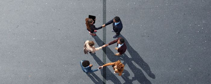 IT Mergers & Acquisition - group shaking hands