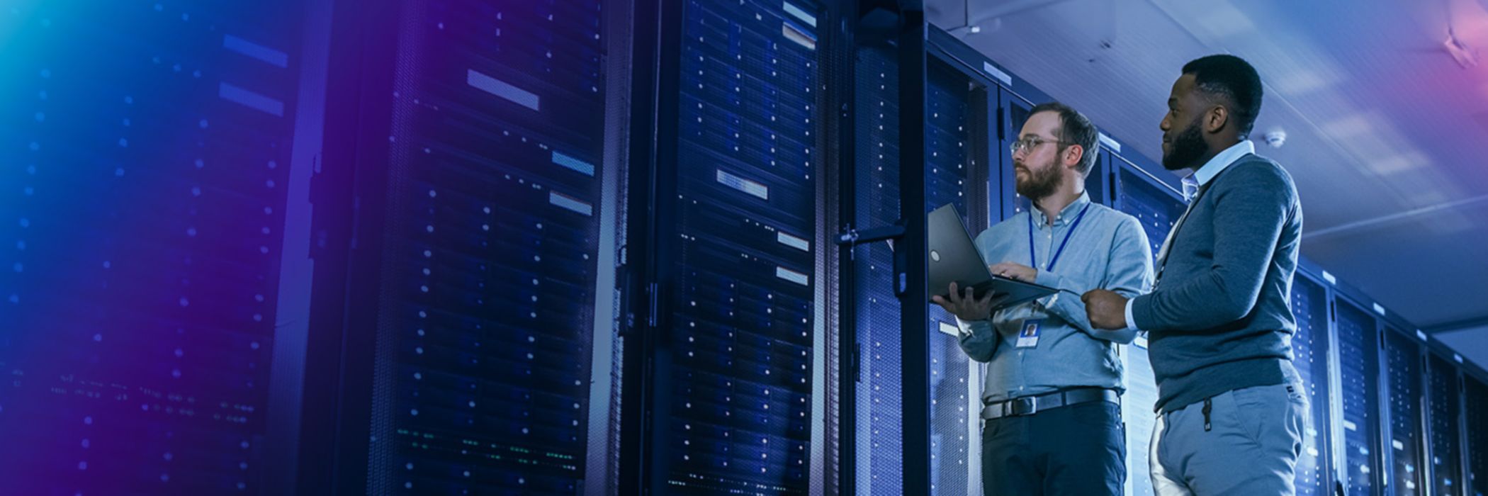 IT specialists looking at servers