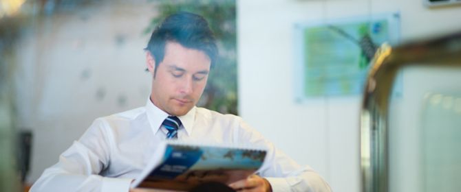 Businessman reading a brochure