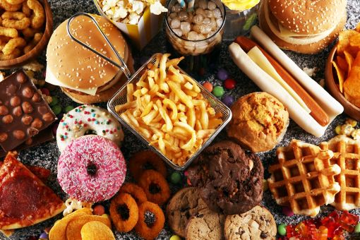 A top view of various junk foods