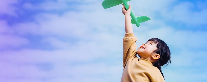 Child with toy aeroplane