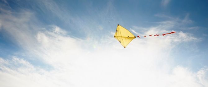 Yellow kite in sky