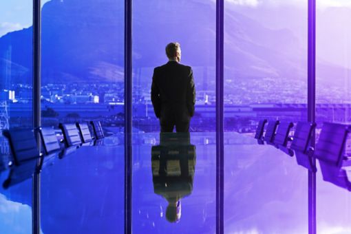 Business Person looking outside a window