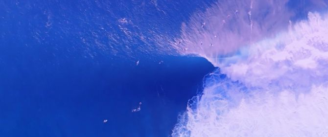 surfer getting big wave