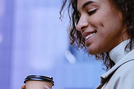 Woman drinking coffee: KPMG Connected Enterprise