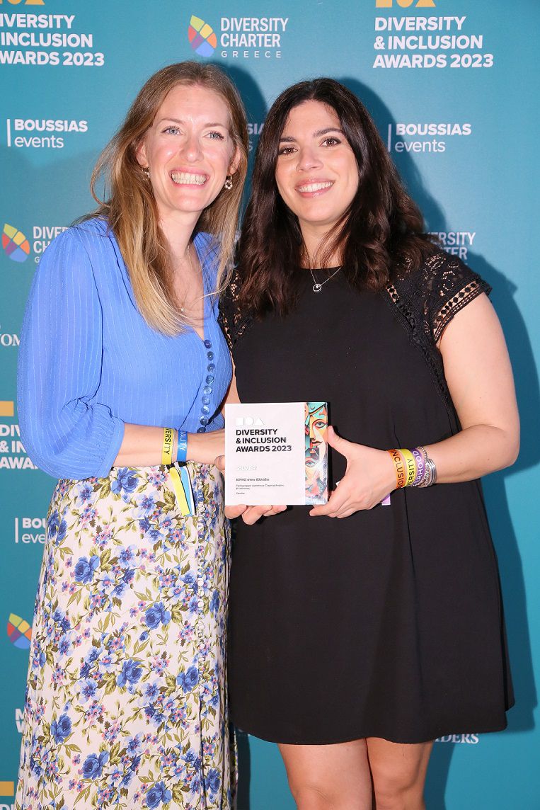 Eleutheria Tournopetraki and Maria Kastrisiou holding the silver award at diversity and inclusion awards 2023