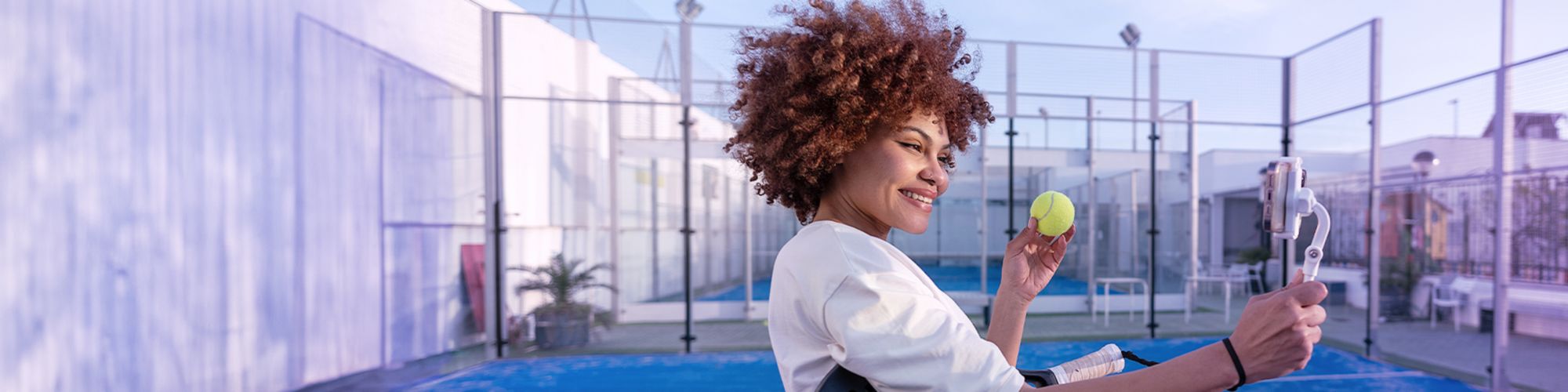 A woman with a tennis ball