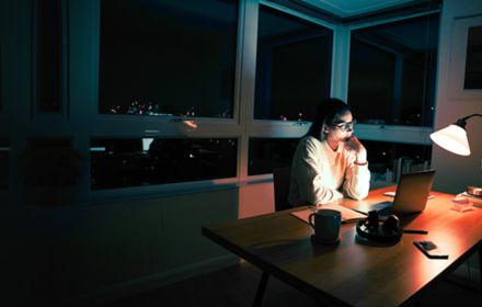 lady working on laptop at night banner