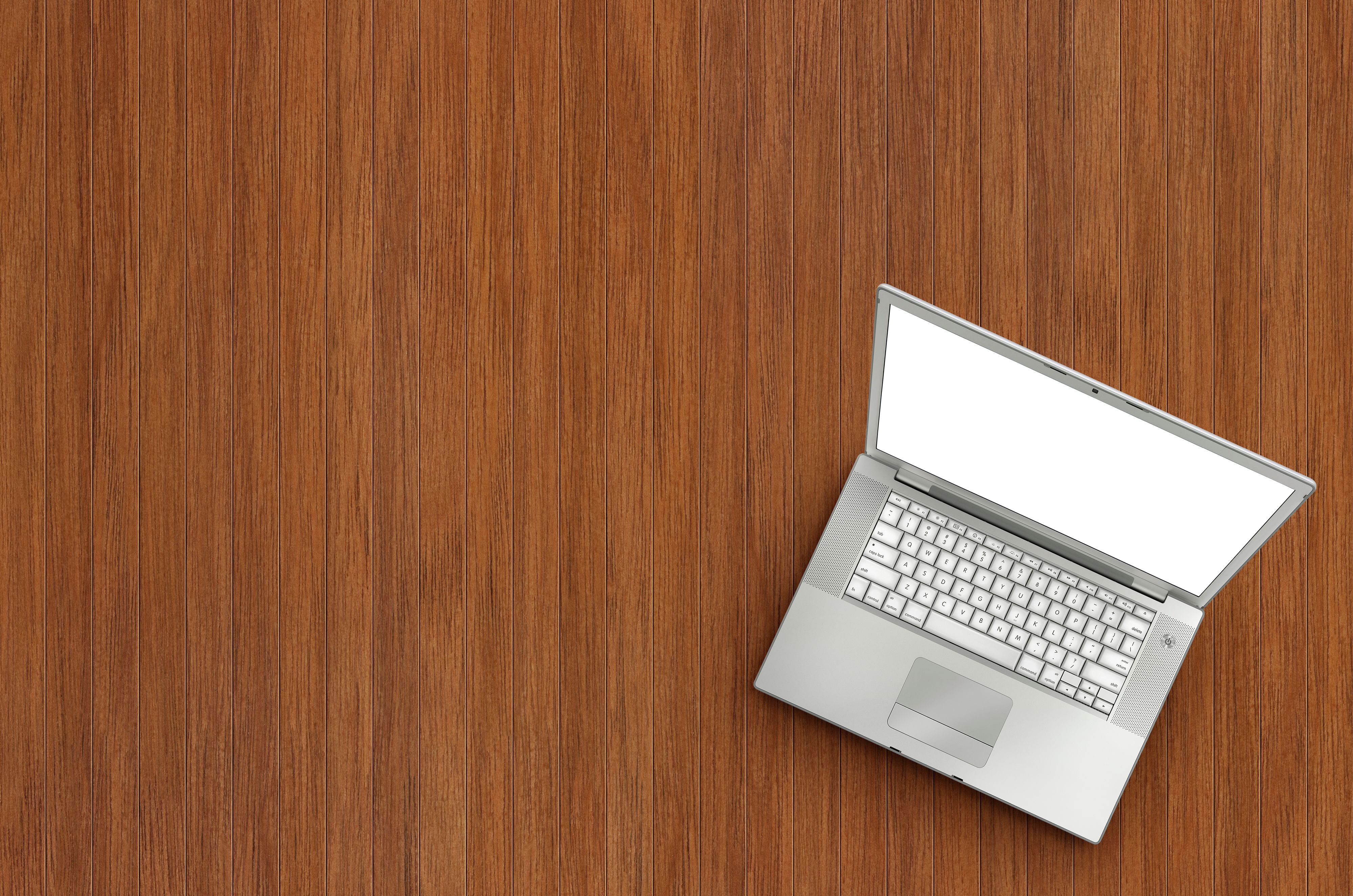 laptop on wooden background