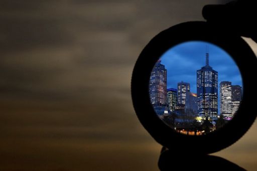 Looking at city through magnifying glass