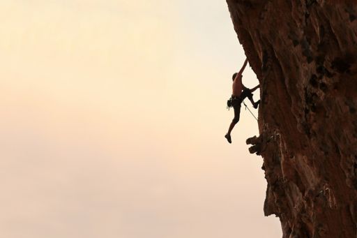 Man climbing on the rock mountain