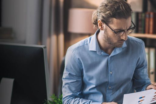 Man looking at graph