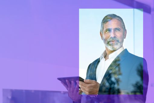 man looking out of window