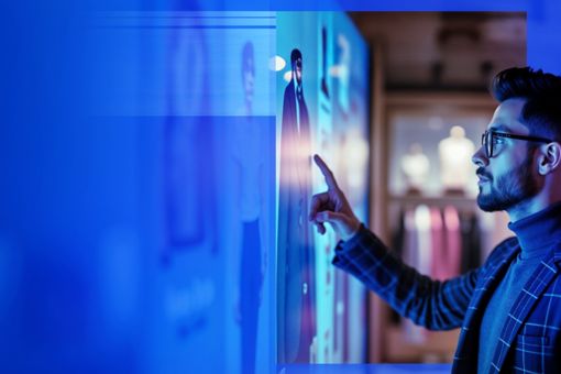 Man looking at screen with reflections
