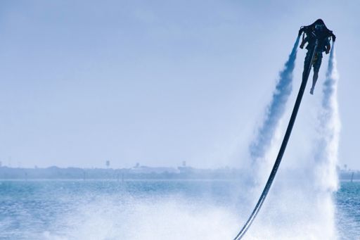 Man on flyboard on water