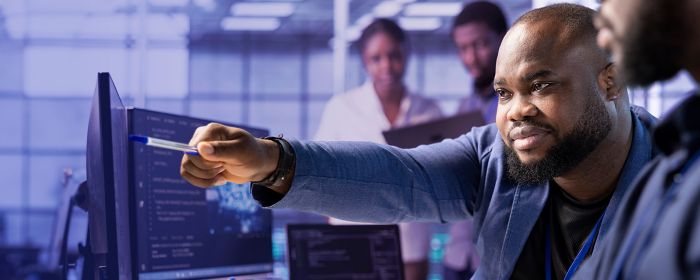 man pointing at screen