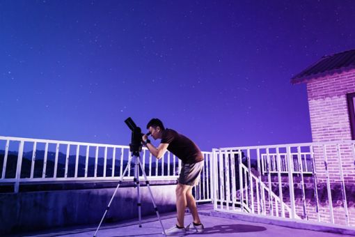 Man using Telescope