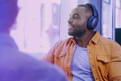 Man with headphone sitting in bus