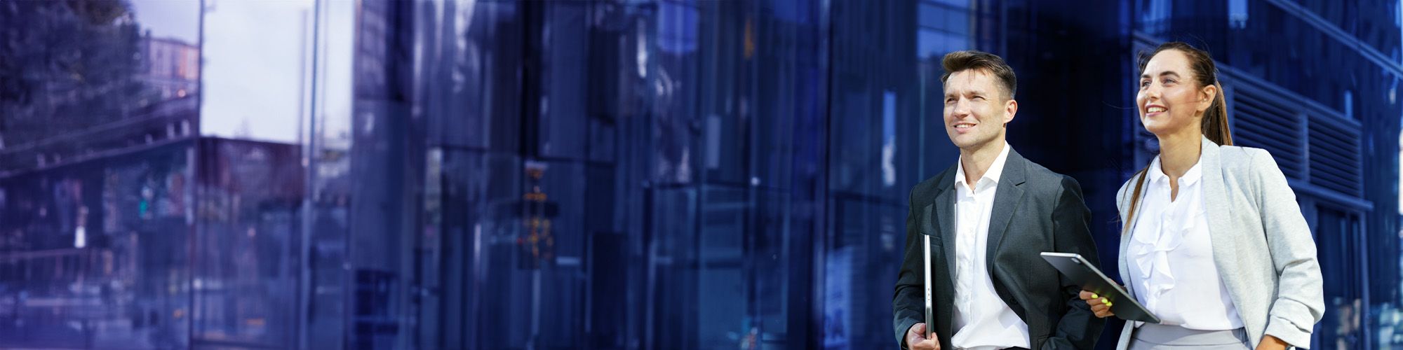 male hiker sitting on edge of a rock