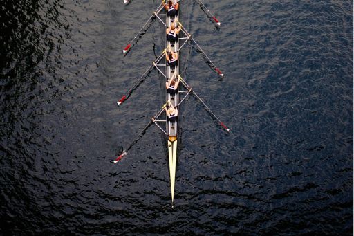Men rowing boat on water