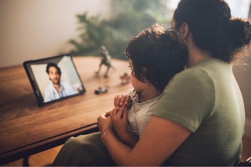 Mother and son having video call with doctor