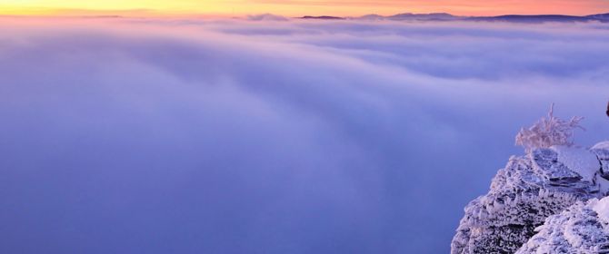 mountain view of a sea of clouds at sunset