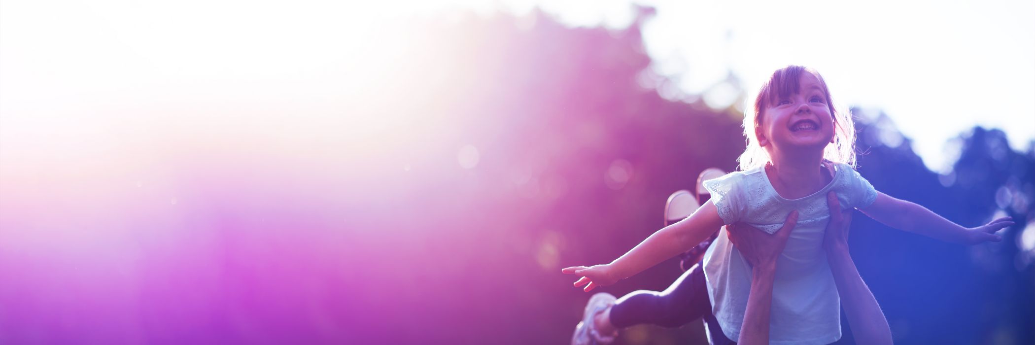 Young girl being lifted up flying