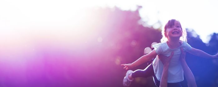 Young girl being lifted up flying