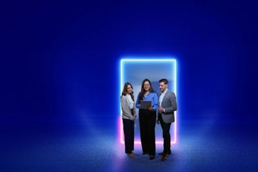 Three people standing in front of a glowing neon portal in a city at night