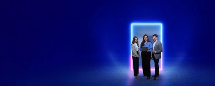 Three people standing in front of a glowing neon portal in a city at night