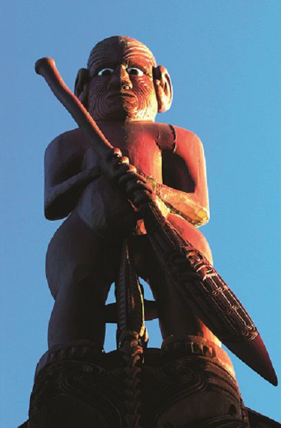 Traditional Maori carvings on a Waka boat