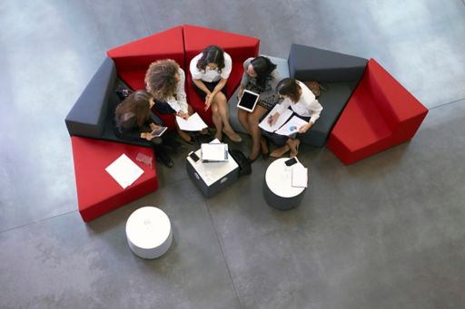 Employees meeting in an office lobby