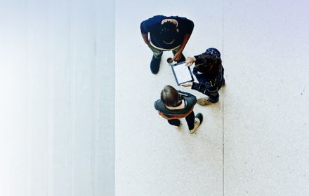 Overhead view of workers collaborating