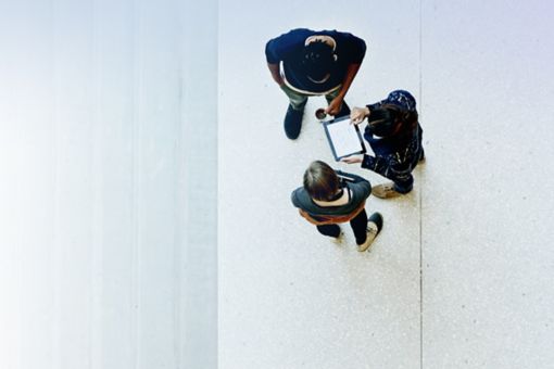 Overhead view of workers collaborating