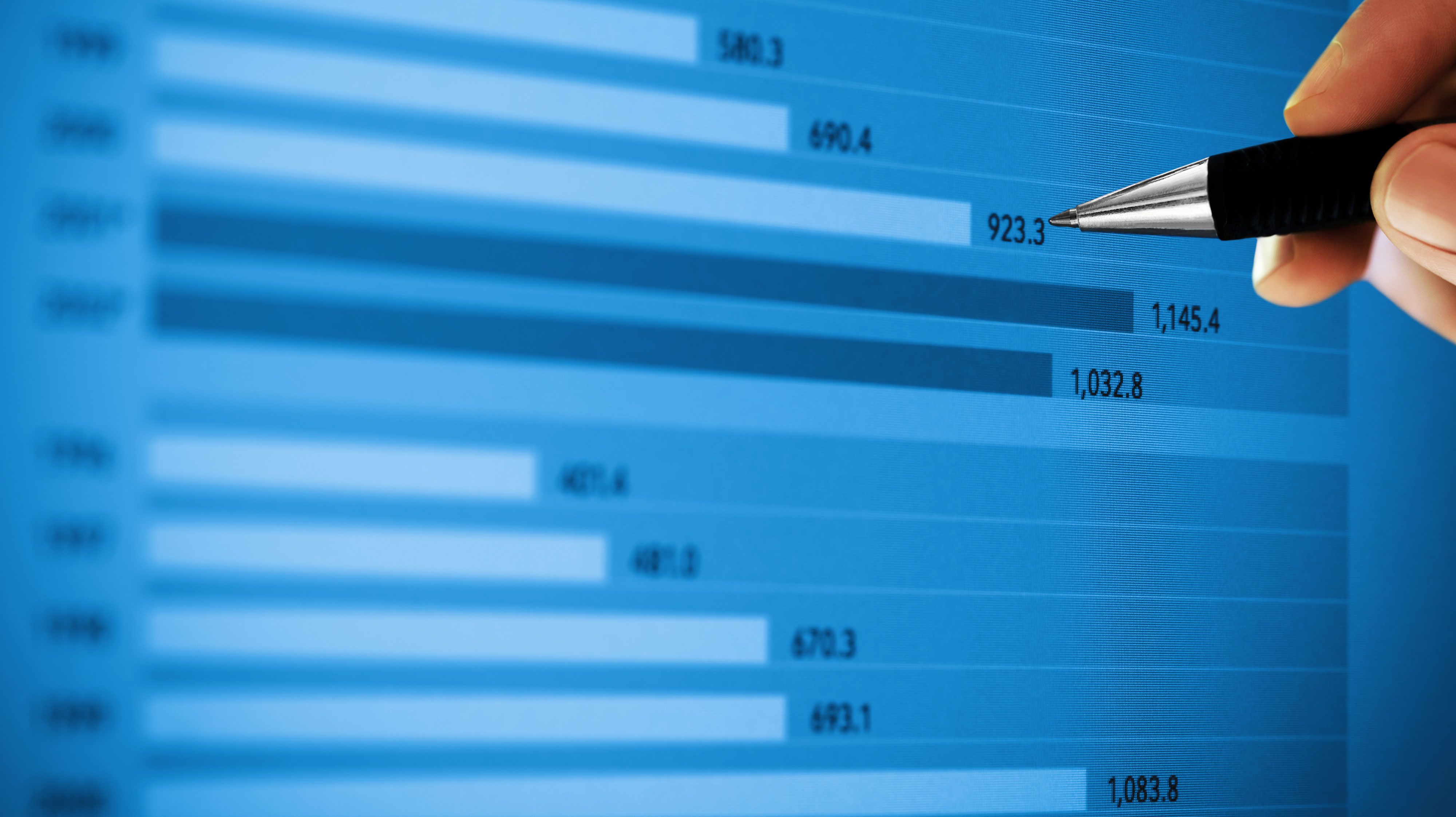 pen pointing at graph