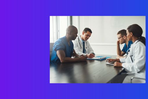 People in healthcare having a meeting at a table in an office