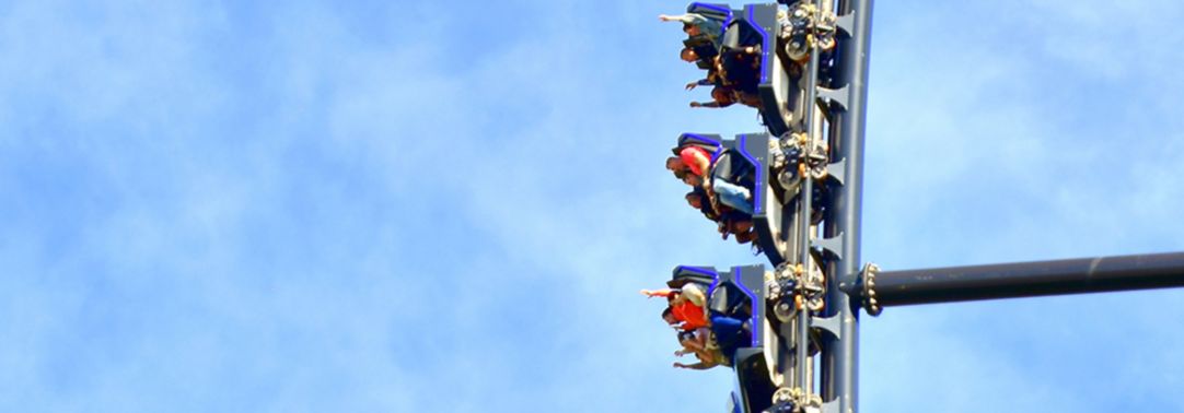 People sitting in rollercoaster ride