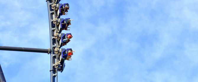 People sitting in rollercoaster ride