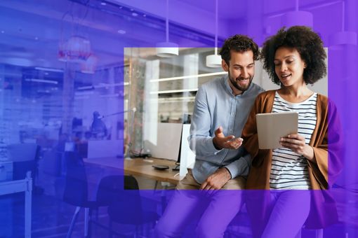 People looking at a tablet in an office with a purple overlay