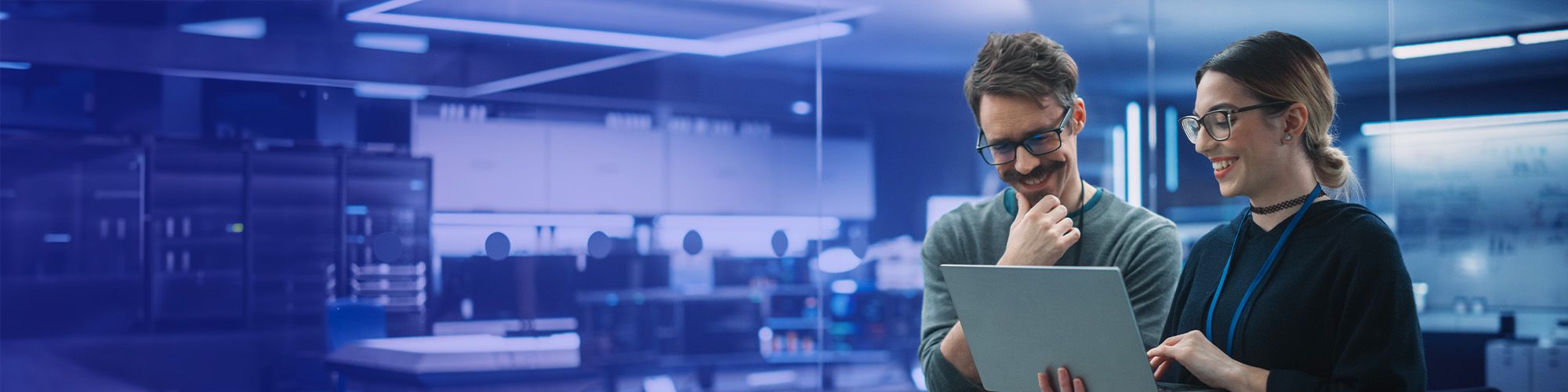 two people looking at laptop