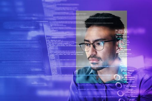 Person with glasses looking at data