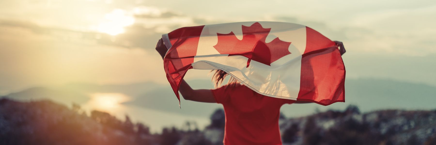 Person holding Canadian flag