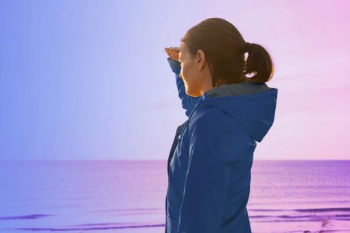 Person looking at the horizon over water