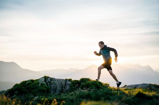 Person running on mountain top